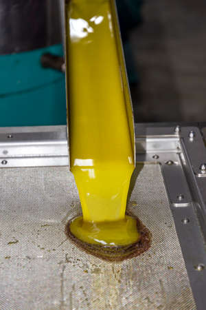 transformation of olives into oil in an oil mill in greeceの写真素材