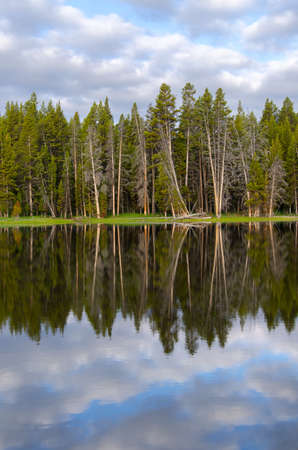 sunrise in Yellowstone lake in Yellowstone National Park in Wyomingの写真素材