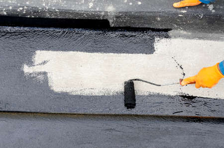 laying of waterproofing sheathing and insulation during the renovation of a roof in Italyの写真素材