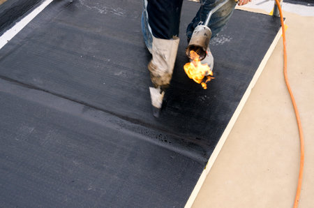 laying of waterproofing sheathing and insulation during the renovation of a roof in Italyの写真素材