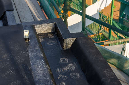laying of waterproofing sheathing and insulation during the renovation of a roof in Italyの写真素材