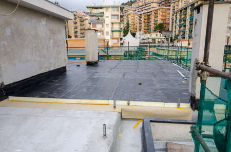 laying of waterproofing sheathing and insulation during the renovation of a roof in Italyの写真素材