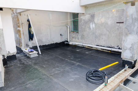 laying of waterproofing sheathing and insulation during the renovation of a roof in Italyの写真素材