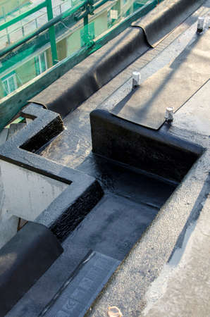 laying of waterproofing sheathing and insulation during the renovation of a roof in Italyの写真素材