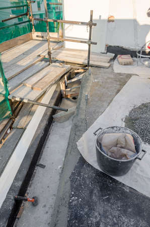 laying of waterproofing sheathing and insulation during the renovation of a roof in Italyの写真素材