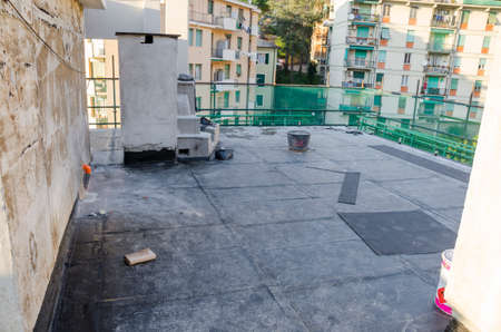laying of waterproofing sheathing and insulation during the renovation of a roof in Italyの写真素材
