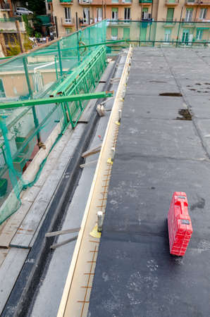 laying of waterproofing sheathing and insulation during the renovation of a roof in Italyの写真素材
