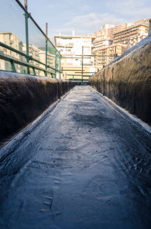 laying of waterproofing sheathing and insulation during the renovation of a roof in Italyの写真素材