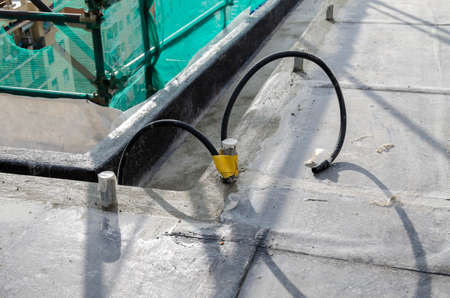 laying of waterproofing sheathing and insulation during the renovation of a roof in Italyの写真素材