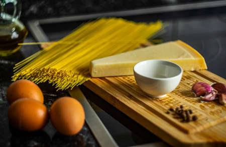 gourmet italian pasta spaghetti carbonara with eggs parmesan cheese garlic and pepperの写真素材