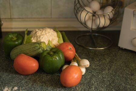 Vegetable still life in wooden kitchenの写真素材