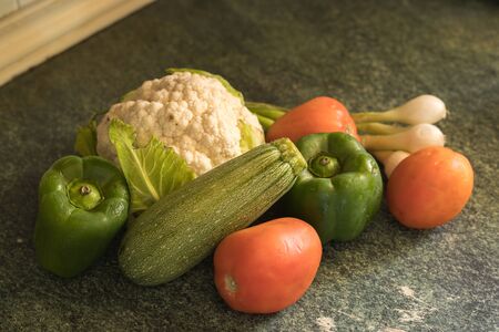 Vegetable still life in wooden kitchenの写真素材