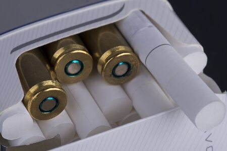 bullets in cigarette packs