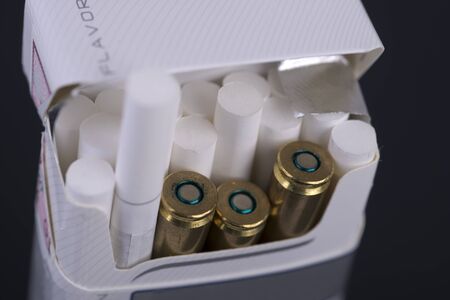 cigarettes and bullets in the packageの写真素材