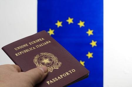Italian passport and the European flagの写真素材
