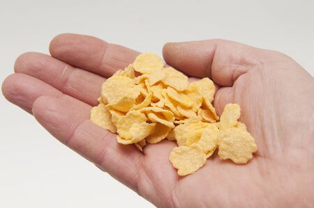 cornflakes in handの写真素材