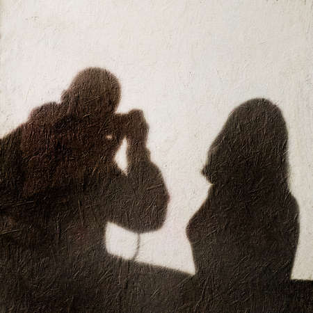 Shadow of a photographer photographing a modelの写真素材