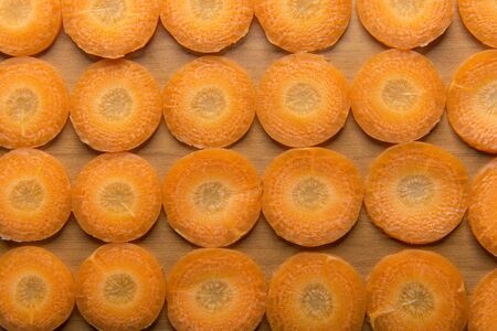 slices carrots on the kitchen tableの写真素材