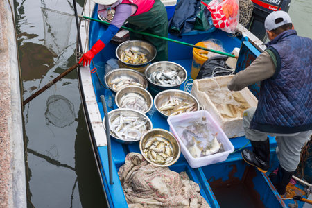fishmongers on Their boat in the village of Tai O in Hong Kongのeditorial素材