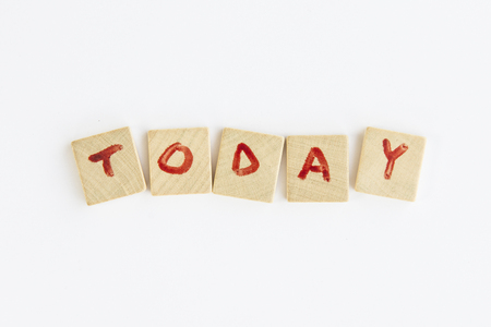 Today word formed with the letters written on pieces of wood squareの写真素材