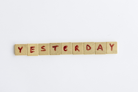 Yesterday word formed with the letters written on pieces of wood square