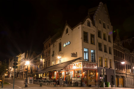 Traditional bar on the street in downtown Brussels at nightのeditorial素材
