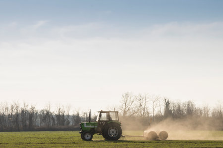 a tractor while plowing in soil