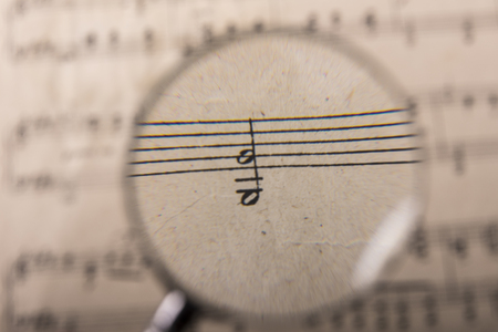 View through a magnifying glass of notes in a music scoreの写真素材