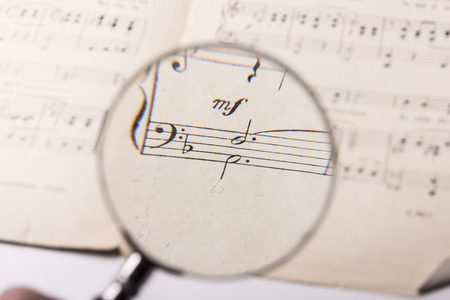 View through a magnifying glass of notes in a music scoreの写真素材