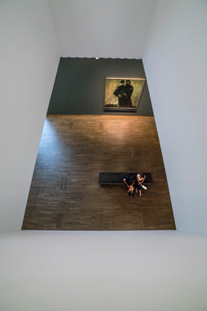 A visitor sitting in front of an opera at the Leopold Museum in Viennaのeditorial素材