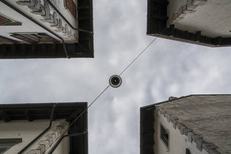 street lamp at the center of a road crossing