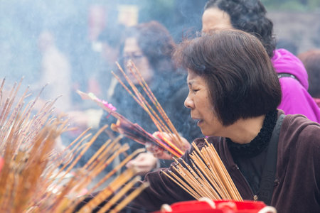 the lighting of the incense sticks in Wong Tai temple in Hong Kongのeditorial素材