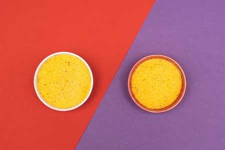 cornmeal a bowl on a colored backgroundの写真素材