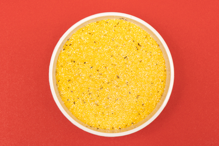 cornmeal a bowl on a colored backgroundの写真素材