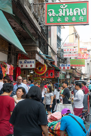 People walk in Chinatown streets in Bangkokのeditorial素材