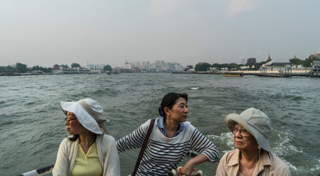 Tourists in a boat on Mae Nam Chao Phraya river in Bangkok, Thailandのeditorial素材