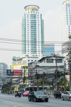 an electrical transformer and cables on the road in Bangkok, Thailandのeditorial素材