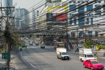 an electrical transformer and cables on the road in Bangkok, Thailand