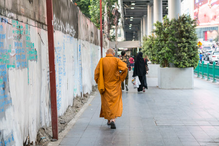 A monk walking on the street in Bangkok, Thailand