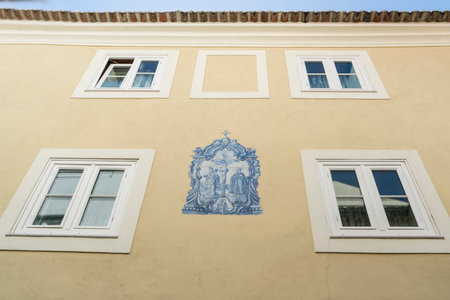the decoration with the typical tiles on a house in the center of Lisbon, Portugalのeditorial素材