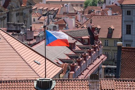 the Czech flag between the roofs of the housesのeditorial素材