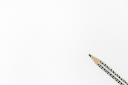 a pencil on a sheet of white paperの写真素材