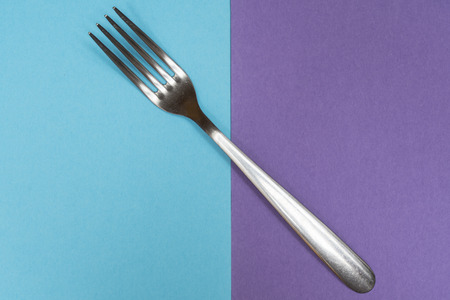 A fork on a two colored surfaceの写真素材