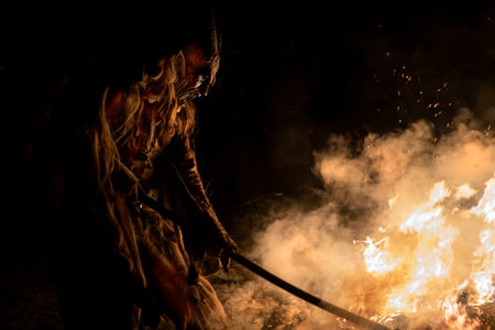The Krampus masks in an exhibition in the night in Tarvisio, Italyのeditorial素材