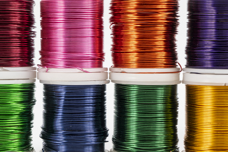 Some  spools of colored metallic thread
