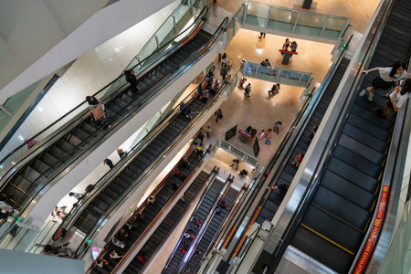 view of the escalators inside the SURIA shopping mall in Kuala Lumpur, Malaysia