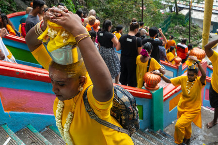 Kuala Lumpur, Malaysia. January 2019.  faithful who climb the long stairway leading to the temples...