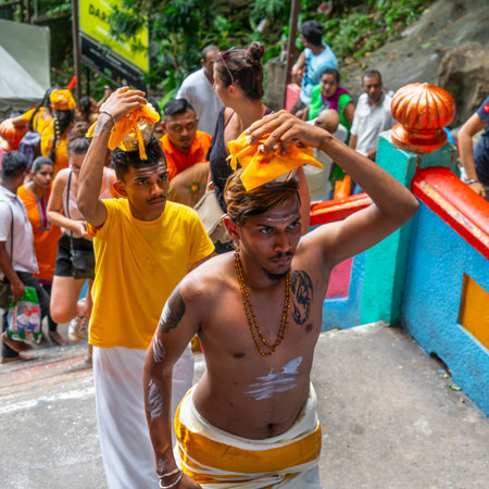 Kuala Lumpur, Malaysia. January 2019.  faithful who climb the long stairway leading to the temples at Batu Cavesのeditorial素材