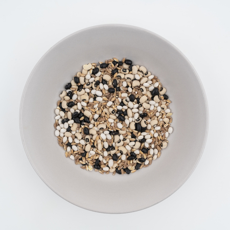 A mixed dried cereals (spelled, barley and beans) on a plateの写真素材