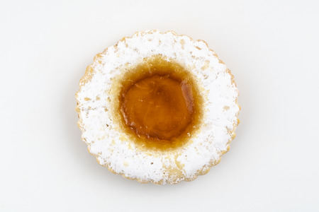 round pastries of pastry and jam on a white surfaceの写真素材